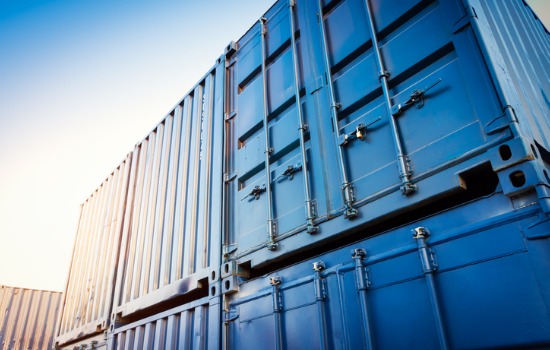 Big blue Shipping Containers stacked on top of each other