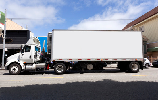 Semi truck carries one of many refrigerated containers for Iowa City IA